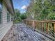 Wooden deck with railings provides scenic views at 853 Cr 484, Lake Panasoffkee, FL 33538