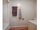 Clean bathroom with new flooring and towel rack at 853 Cr 484, Lake Panasoffkee, FL 33538