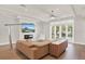 Spacious living room with a large sectional sofa and a modern fireplace at 137 S Park Ave, Winter Garden, FL 34787