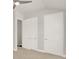 Bedroom with double doors to closets and an additional door at 137 S Park Ave, Winter Garden, FL 34787