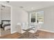 Dining room with glass table and six white chairs at 137 S Park Ave, Winter Garden, FL 34787