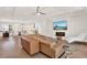 Open living space with a stylish sectional sofa and hardwood floors at 137 S Park Ave, Winter Garden, FL 34787