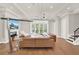 Spacious living room with sectional sofa and modern fireplace at 137 S Park Ave, Winter Garden, FL 34787