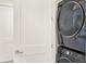 Laundry closet with stacked washer and dryer at 137 S Park Ave, Winter Garden, FL 34787