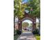 Brick archway entrance to Winter Garden, featuring landscaping and a clock at 137 S Park Ave, Winter Garden, FL 34787