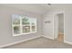 Bright bedroom with large window, carpet, and spacious closet at 137 S Park Ave, Winter Garden, FL 34787
