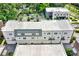 Aerial view of townhomes with attached garages and a flat roof at 137 S Park Ave, Winter Garden, FL 34787