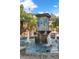 Ornate stone water fountain with blue tile accents and multiple water jets at 137 S Park Ave, Winter Garden, FL 34787