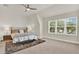 Spacious bedroom with large window, ceiling fan, and rug at 137 S Park Ave, Winter Garden, FL 34787