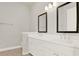 Double vanity bathroom with modern fixtures and mirrors at 137 S Park Ave, Winter Garden, FL 34787