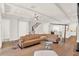 Light and airy living room with sectional sofa and hardwood floors at 137 S Park Ave, Winter Garden, FL 34787