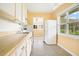 Kitchen with light wood cabinets and appliances at 1620 Morin St, Eustis, FL 32726