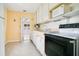 Kitchen with light wood cabinets and appliances at 1620 Morin St, Eustis, FL 32726