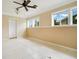 Sunroom with tiled floors and ceiling fan at 1620 Morin St, Eustis, FL 32726