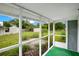 Screened porch overlooking a grassy backyard at 1620 Morin St, Eustis, FL 32726