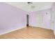 Spacious bedroom with light purple walls at 1620 Morin St, Eustis, FL 32726