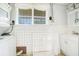 Small kitchen with white cabinets and appliances at 1620 Morin St, Eustis, FL 32726