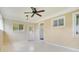 Sunroom with tiled floors and ceiling fan at 1620 Morin St, Eustis, FL 32726
