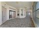 Bright sunroom with tile floors and sliding doors at 21127 Lady Marion Way, Leesburg, FL 34748