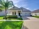 Two-story house with two-car garage and landscaping at 15162 Book Club Rd, Winter Garden, FL 34787