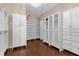 Spacious walk-in closet with ample shelving and hanging space at 7616 Lily Ct, Groveland, FL 34736