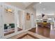 Bright and airy entryway with hardwood floors and views into the living room at 7616 Lily Ct, Groveland, FL 34736