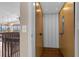 Open elevator with wood paneling and accordion doors at 7616 Lily Ct, Groveland, FL 34736