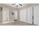 Spacious bedroom with large closets and neutral color palette at 7616 Lily Ct, Groveland, FL 34736