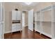 Bright and spacious walk-in closet with built-in shelving and drawers at 7616 Lily Ct, Groveland, FL 34736