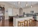Gourmet kitchen featuring an expansive island, custom cabinetry, and high-end appliances at 7616 Lily Ct, Groveland, FL 34736