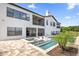 Luxury pool and spa with patio and outdoor seating area at 7616 Lily Ct, Groveland, FL 34736