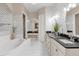 Stunning bathroom with dark countertops and elegant fixtures at 7616 Lily Ct, Groveland, FL 34736