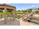Lakeside gazebo with seating area and walkway access at 7616 Lily Ct, Groveland, FL 34736
