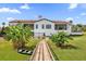 Charming backyard with boardwalk leading to lake access at 7616 Lily Ct, Groveland, FL 34736