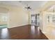 Spacious living area featuring dark brown tile floors and sliding glass doors at 114 Compass Rose Dr, Groveland, FL 34736