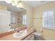 Clean bathroom with updated vanity, toilet, and shower at 114 Compass Rose Dr, Groveland, FL 34736