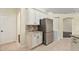 Modern kitchen with stainless steel appliances and granite countertops at 114 Compass Rose Dr, Groveland, FL 34736