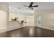 Open living room with a view into the kitchen and breakfast bar at 114 Compass Rose Dr, Groveland, FL 34736