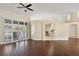 Living room with tile floors, access to pool, and an open floor plan at 114 Compass Rose Dr, Groveland, FL 34736