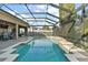 Large screened pool and spa at 114 Compass Rose Dr, Groveland, FL 34736