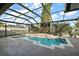 Relaxing screened pool area with waterfall feature at 114 Compass Rose Dr, Groveland, FL 34736