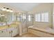 Large bathroom with a soaking tub, shower, and double vanity at 114 Compass Rose Dr, Groveland, FL 34736