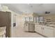 Updated kitchen featuring granite countertops and white cabinets at 114 Compass Rose Dr, Groveland, FL 34736