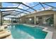 Large screened pool with spacious patio and pergola at 114 Compass Rose Dr, Groveland, FL 34736