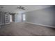 Primary bedroom with barn door and ceiling fan at 1340 Banbridge Dr, Kissimmee, FL 34758