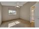 Bedroom with tile floors and access to bathroom at 3921 Doune Way, Clermont, FL 34711