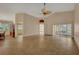 Open living space with tile floor and sliding glass doors at 3921 Doune Way, Clermont, FL 34711