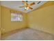 Bright bedroom with ceiling fan and tile floors at 3921 Doune Way, Clermont, FL 34711