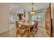 Open dining room with a view into the kitchen and Gathering room at 3921 Doune Way, Clermont, FL 34711