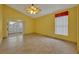 Spacious living area with tile floors and sliding glass doors at 3921 Doune Way, Clermont, FL 34711
